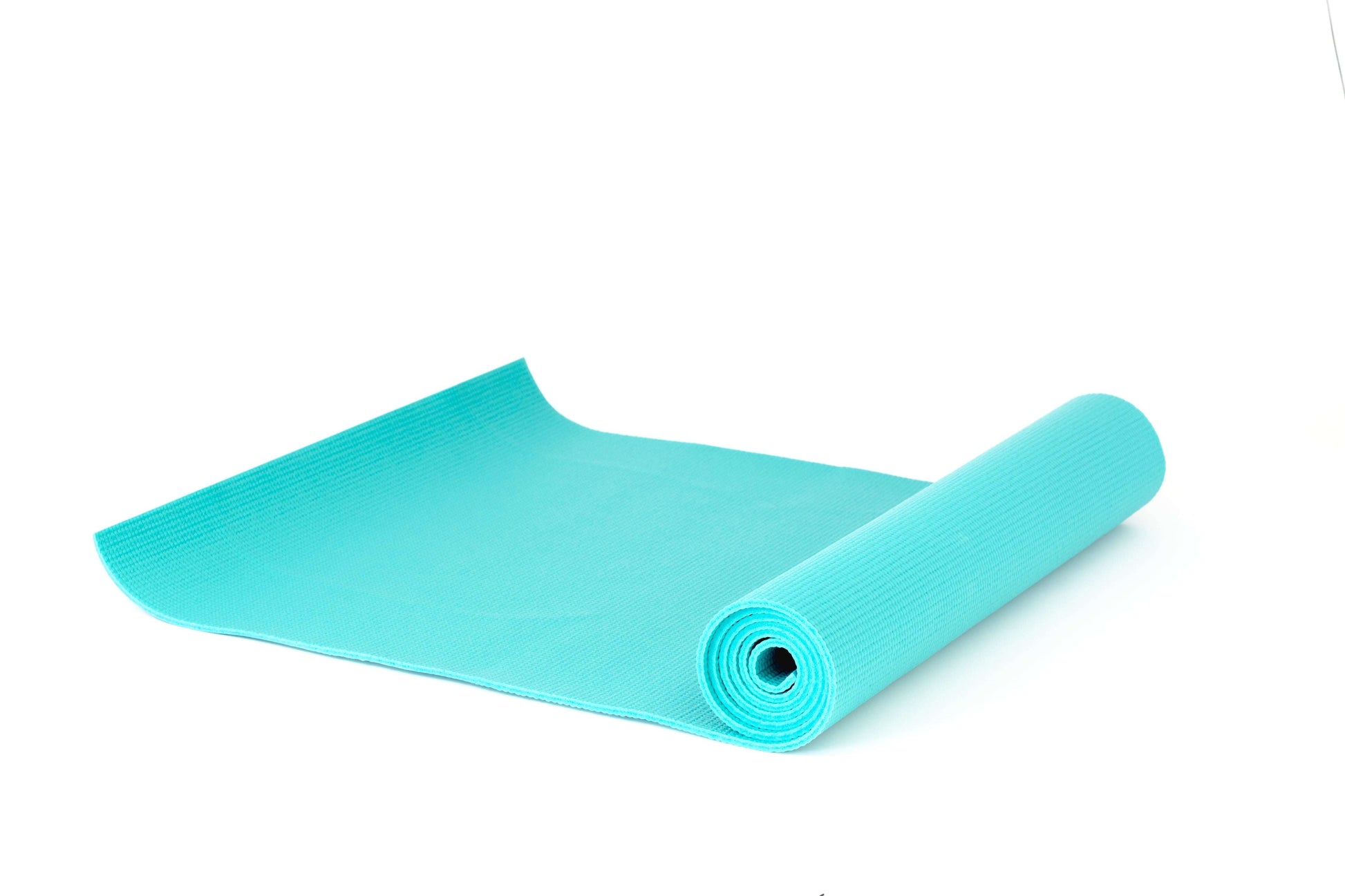 Vibrant teal yoga mat partially unrolled with a non-slip textured surface for supportive comfort during wellness routines. [ShopZip]